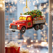 Red truck ornament with Christmas tree and presents against a cityscape background