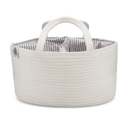 White woven basket with striped interior on a white background