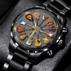 Watch with guitar-themed face on a dark textured background