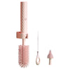 Set of pink kitchen brushes with different bristle designs on a white background